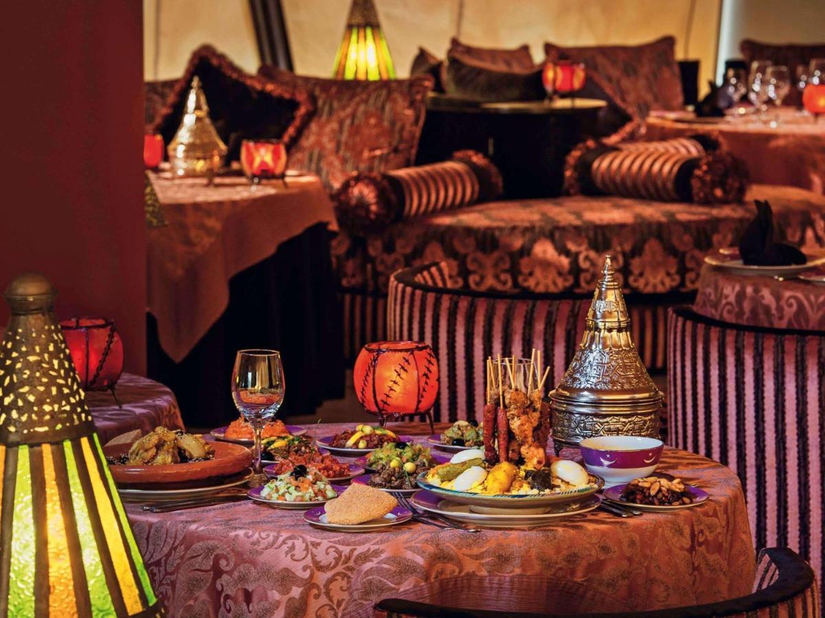 Moevenpick Hotel & Casino Malabata Tanger Exterior photo A table at Al Dar