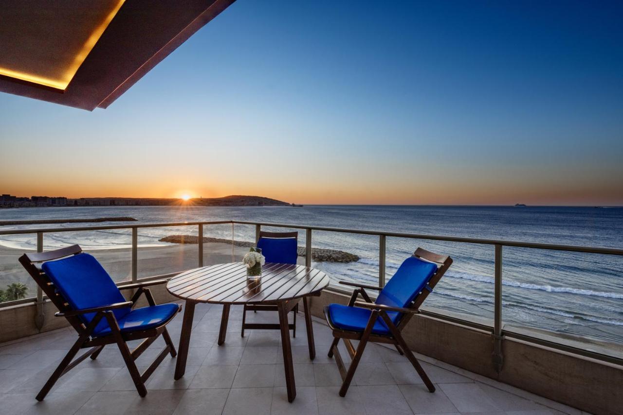 Moevenpick Hotel & Casino Malabata Tanger Exterior photo Sunset at the beach